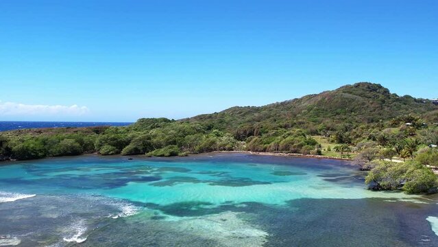 drone aerial view of an empty beach in roatan honduras