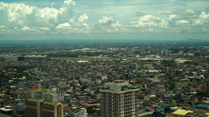 Populous city of Manila, the capital of the Philippines with skyscrapers, streets and buildings. Travel vacation concept.
