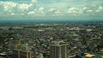 Fototapeta premium Populous city of Manila, the capital of the Philippines with skyscrapers, streets and buildings. Travel vacation concept.