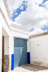 Fototapeta na wymiar Blue painted door in the center of El Toboso (Spain)
