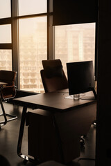 evening empty workplace of a manager in a modern stylish office with panoramic windows