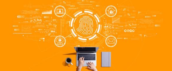 Fingerprint scanning theme with person working with a laptop