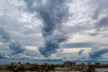 Fototapeta na wymiar dramatic blue cloud over the city.