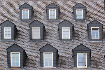 Attic windows on the roof of an old building