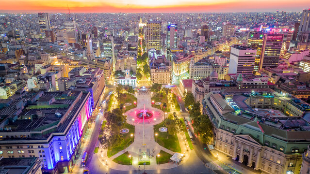 Aerial Buenos Aires  Obelisk July 9 Avenue at Night with Neon Lights Pumping, Drone Fly Above Latin American Cosmopolitan City