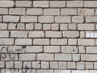 Old brick wall texture background, pattern. Brickwork, stonework, facade, rough surface close-up.