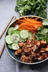 healthy food - vegan buddha bowl with vegetables and fried tofu
