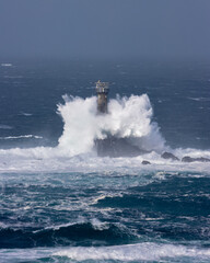 The Longships Lighthouse at Lands end in a storm
