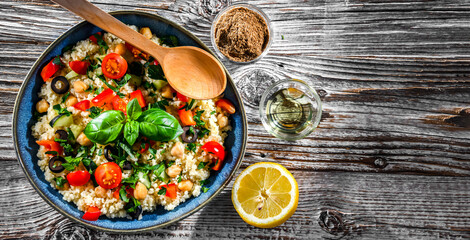 A plate of couscous served with vegetables and chickpeas