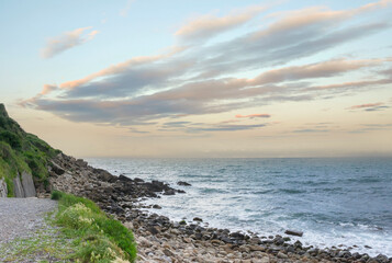 Sunset on the beach with no waves and calm water in Zumaia or Zumaya, Basque Country, Spain
