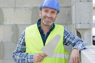 worker before plastering a wall