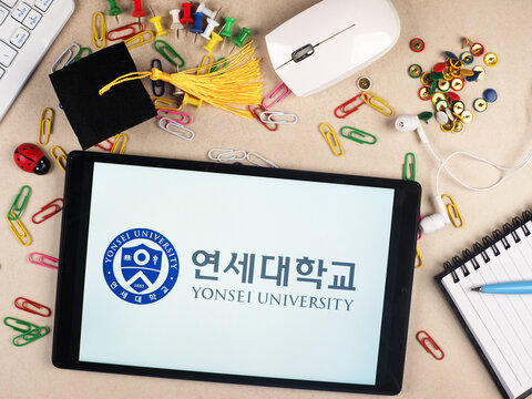 In this photo illustration,  Yonsei University  logo seen displayed on a tablet.