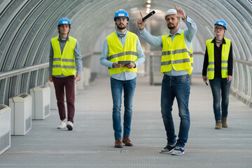 engineers at construction site talking