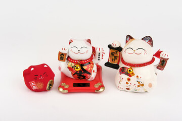 Three white and red chinese good fortune luck cats