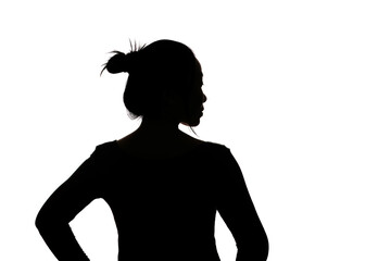 Black backlit silhouette of head and shoulders of an oriental woman from back view outlined by light