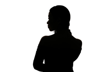 Black backlit silhouette of head and shoulders of an oriental woman from back view outlined by light