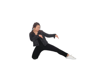 Fototapeta na wymiar Asian young woman doing martial arts in everyday casual street clothing