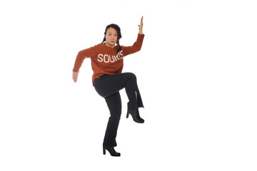 Asian young woman doing martial arts in everyday casual street clothing