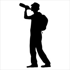silhouette of a mountain climber drinking