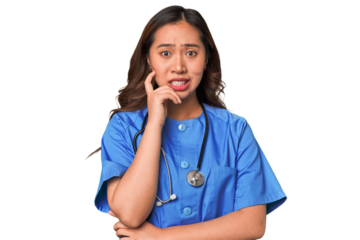A young nurse chinese woman biting fingernails, nervous and very anxious.