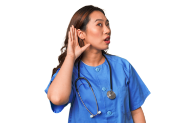 A young nurse chinese woman trying to listening a gossip.