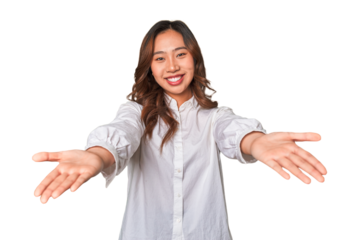 A young chinese woman showing a welcome expression.