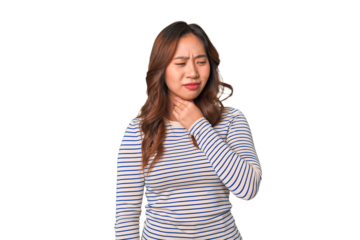 A young chinese woman suffers pain in throat due a virus or infection.