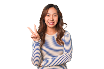 A young chinese woman showing number two with fingers.