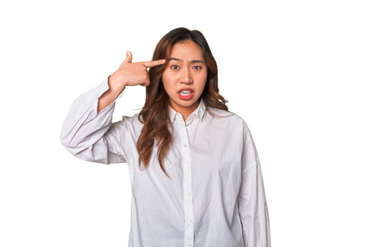 A young chinese woman showing a disappointment gesture with forefinger.