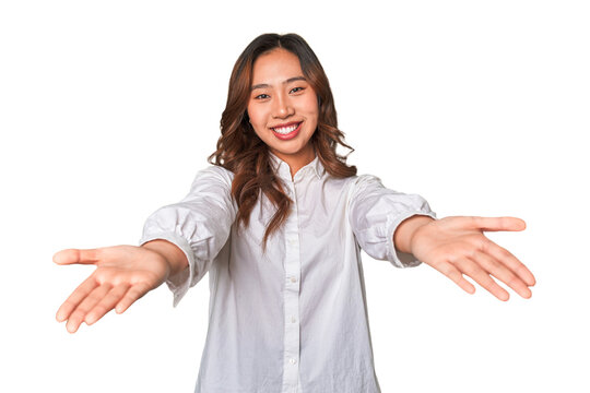A young chinese woman showing a welcome expression.