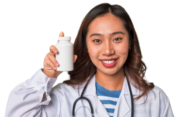 A young Chinese doctor holding a pill container with a smile, promoting health and wellness through medication and care.