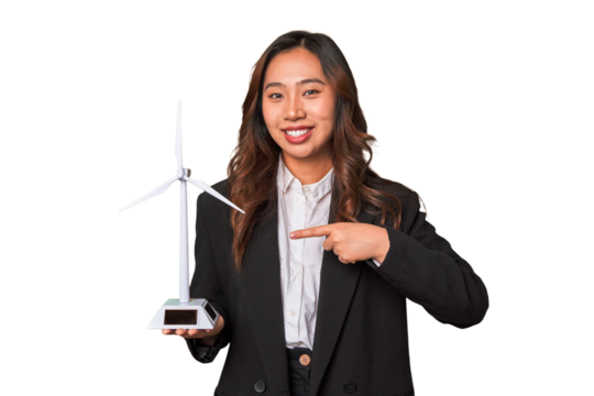 A young Chinese businesswoman proudly holds a windmill, symbolizing her commitment to renewable energy and sustainable development.