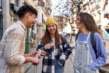 Happy students chatting and laughing together
