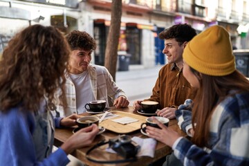 A multicultural group of friends enjoying coffee and tea after their vacation.