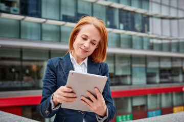 Fototapeta premium A tech-savvy businesswoman! Her digital skills and innovation drive progress while surrounded by the corporate world.