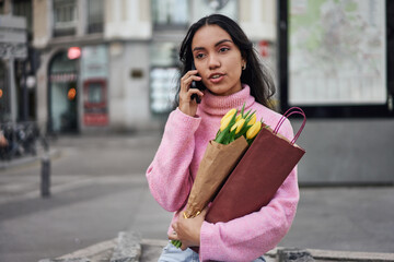 Fototapeta premium Planning a romantic surprise dinner with tulips and wine.