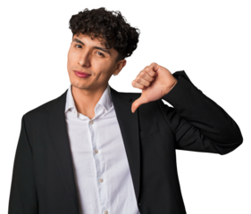 A young latin business man in suit showing a dislike gesture, thumbs down. Disagreement concept.