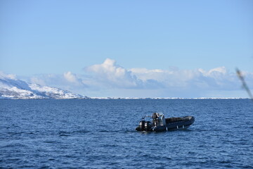 Mountains in the northern part of Norway, at the outlet to the ocean. Incredible sunset