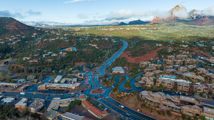 Aerial view of Sedona, Arizona with clouds covering some of the mountains.