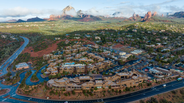 Aerial view of Sedona, Arizona with clouds covering some of the mountains.