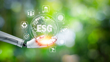 In robot hand the word ESG with icons for environment, social and governance, sustainable corporate development concept in network connection on green background.
