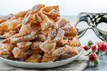 Traditional Italian carnival fritters dusted with icing sugar - frappe or chiacchiere