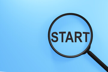 The inscription on the magnifying glass. Start search concept for new beginnings