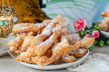 Traditional Italian carnival fritters dusted with icing sugar - frappe or chiacchiere