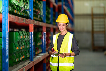 Warehouse workers checking the inventory. Products on inventory shelves storage. .Worker Doing Inventory in Warehouse. Dispatcher in uniform making inventory in storehouse.