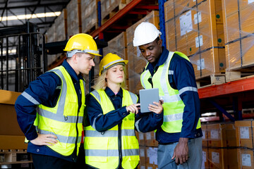 Warehouse workers with uniform working in distribution warehouse.
