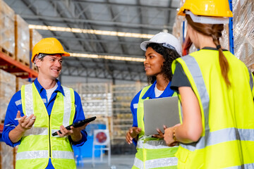 Warehouse workers with uniform working in distribution warehouse.