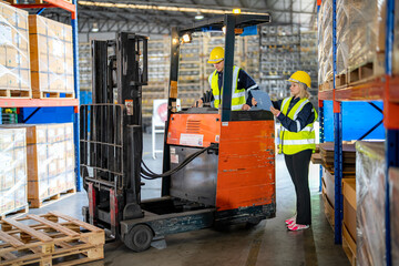 Warehouse workers checking the inventory. Products on inventory shelves storage. .Worker Doing Inventory in Warehouse. Dispatcher in uniform making inventory in storehouse. supply chain concept