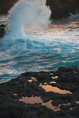 Beautiful sunset waves on the volcanic coast of El Hierro, Canary Islands, reflections,  nature
