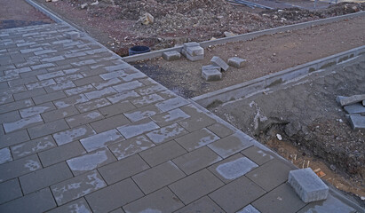 Paving a footpath in a new residential area